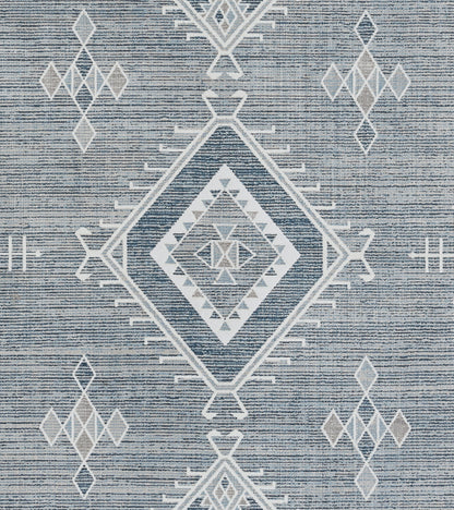Blue woven rug with white geometric diamonds, including a central nested diamond motif.