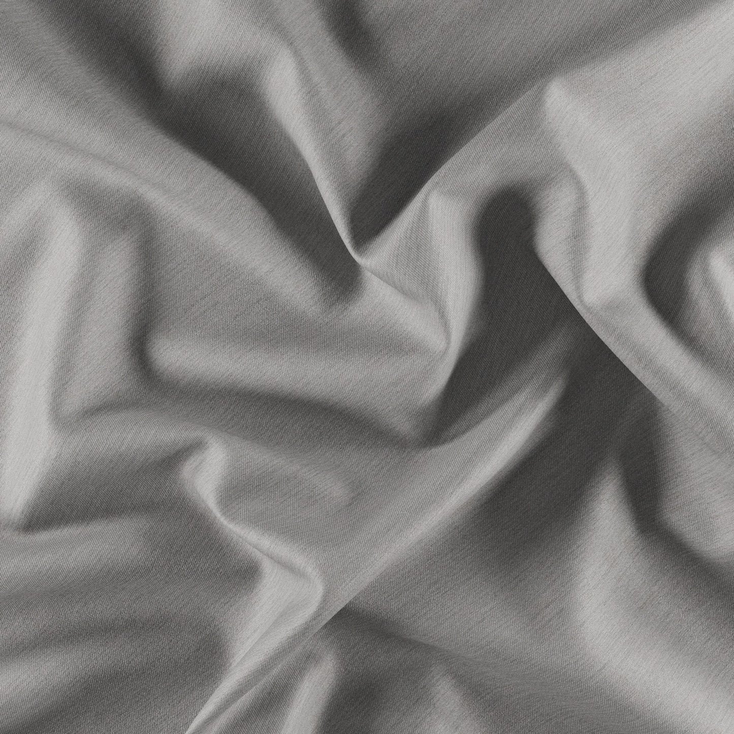 Gray dimout fabric close-up with soft folds and subtle textured weave.