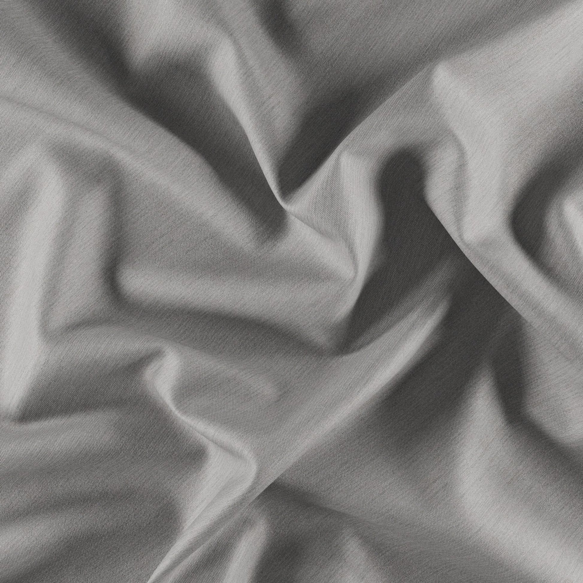 Gray dimout fabric close-up with soft folds and subtle textured weave.