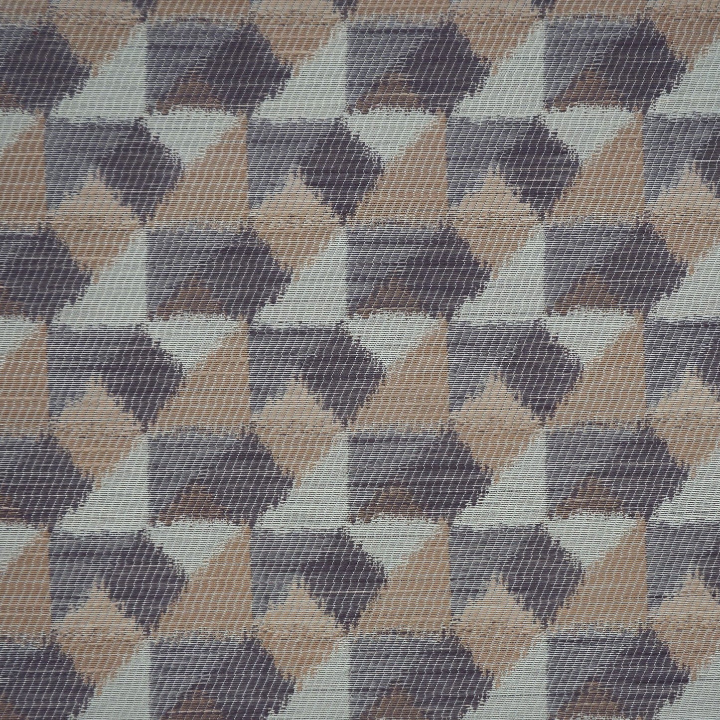 Geometric triangle-patterned woven fabric in tan, taupe, gray—modern upholstery textile.