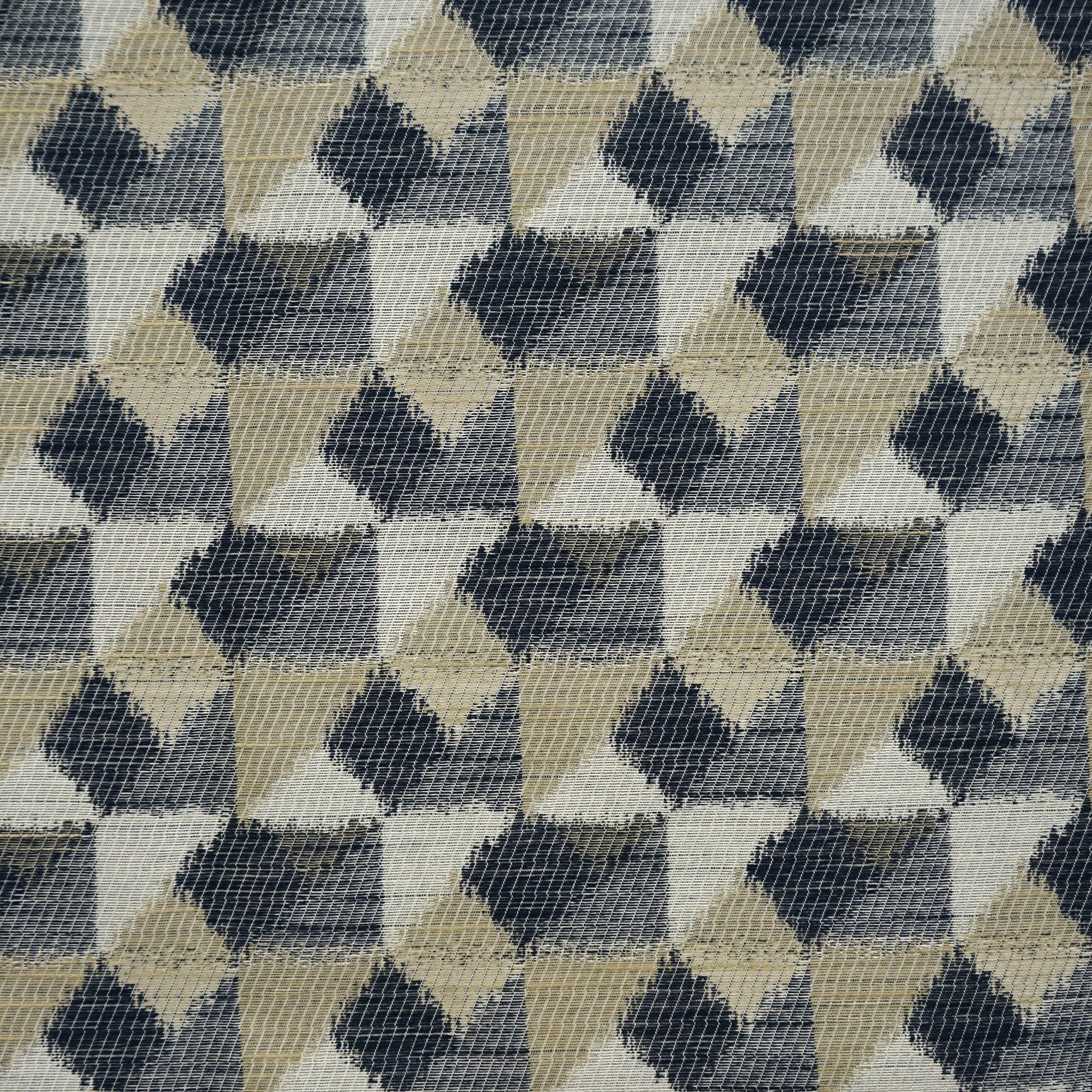Geometric woven fabric with repeating diamond triangles in blue, creme, beige, offwhite and taupe.