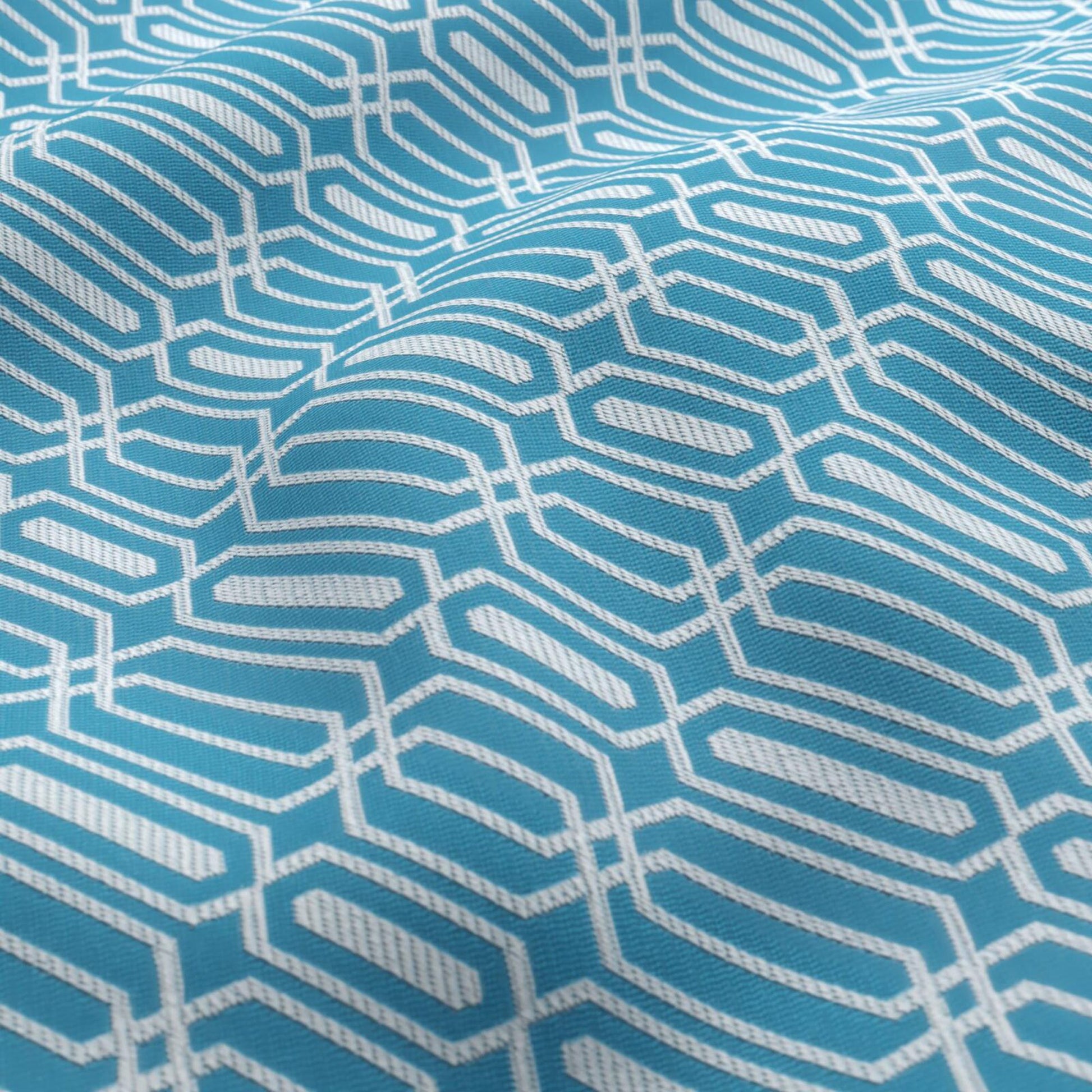 Light blue fabric with a white geometric trellis pattern, creating interlocking hexagon-like shapes.