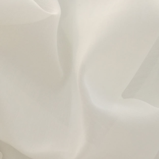 Creme/offwhite sheer fabric with flowing folds and a smooth surface.