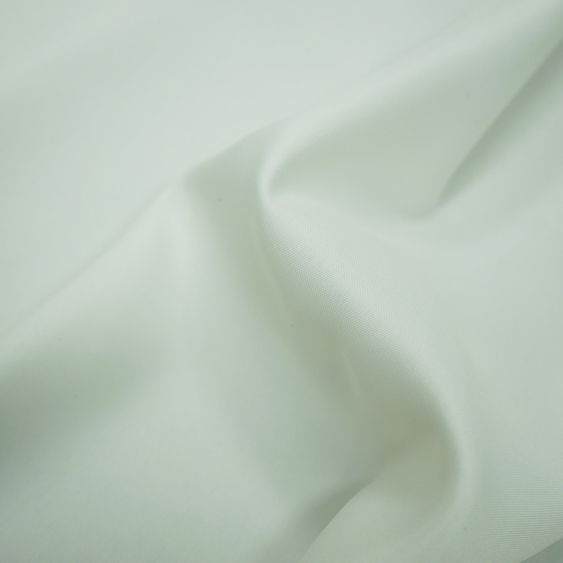 Plain white lining fabric with a smooth drape and gentle folds.