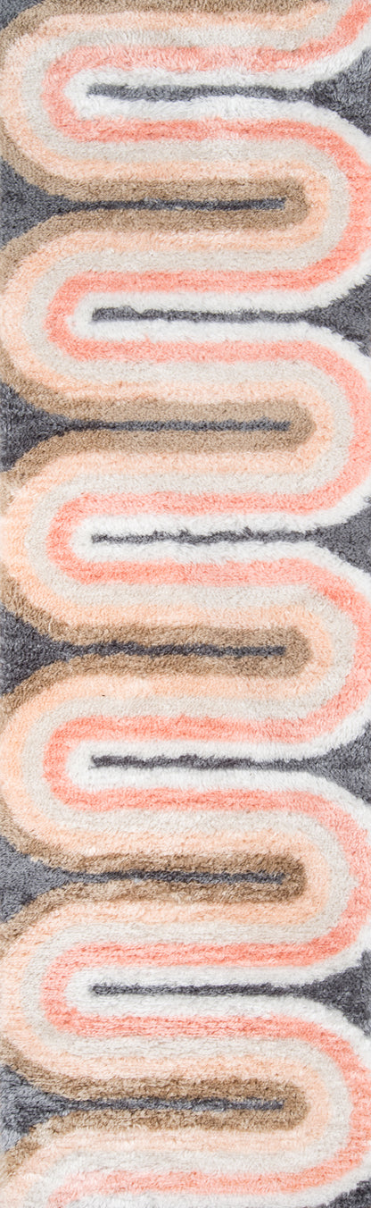 Retro mid-century rug with peach and cream wavy stripes and a dark navy center line on a gray background.