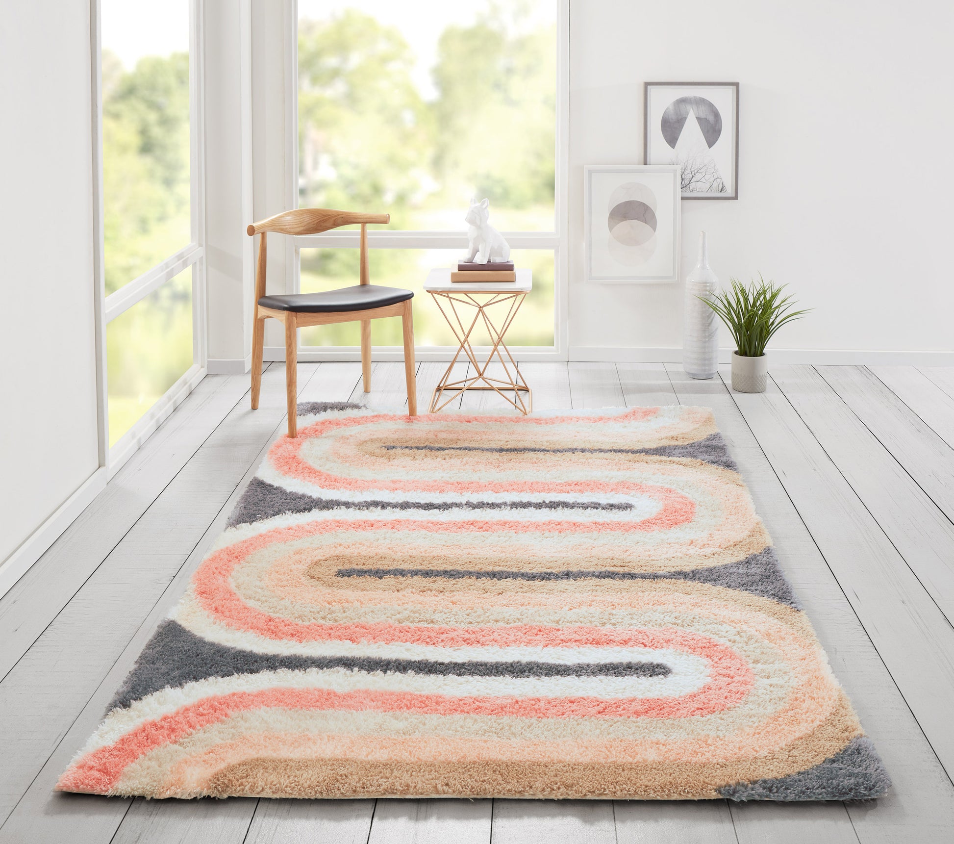 Retro-inspired shag rug in peach, cream and gray with flowing waves in a bright minimalist room, 2' x 3'.