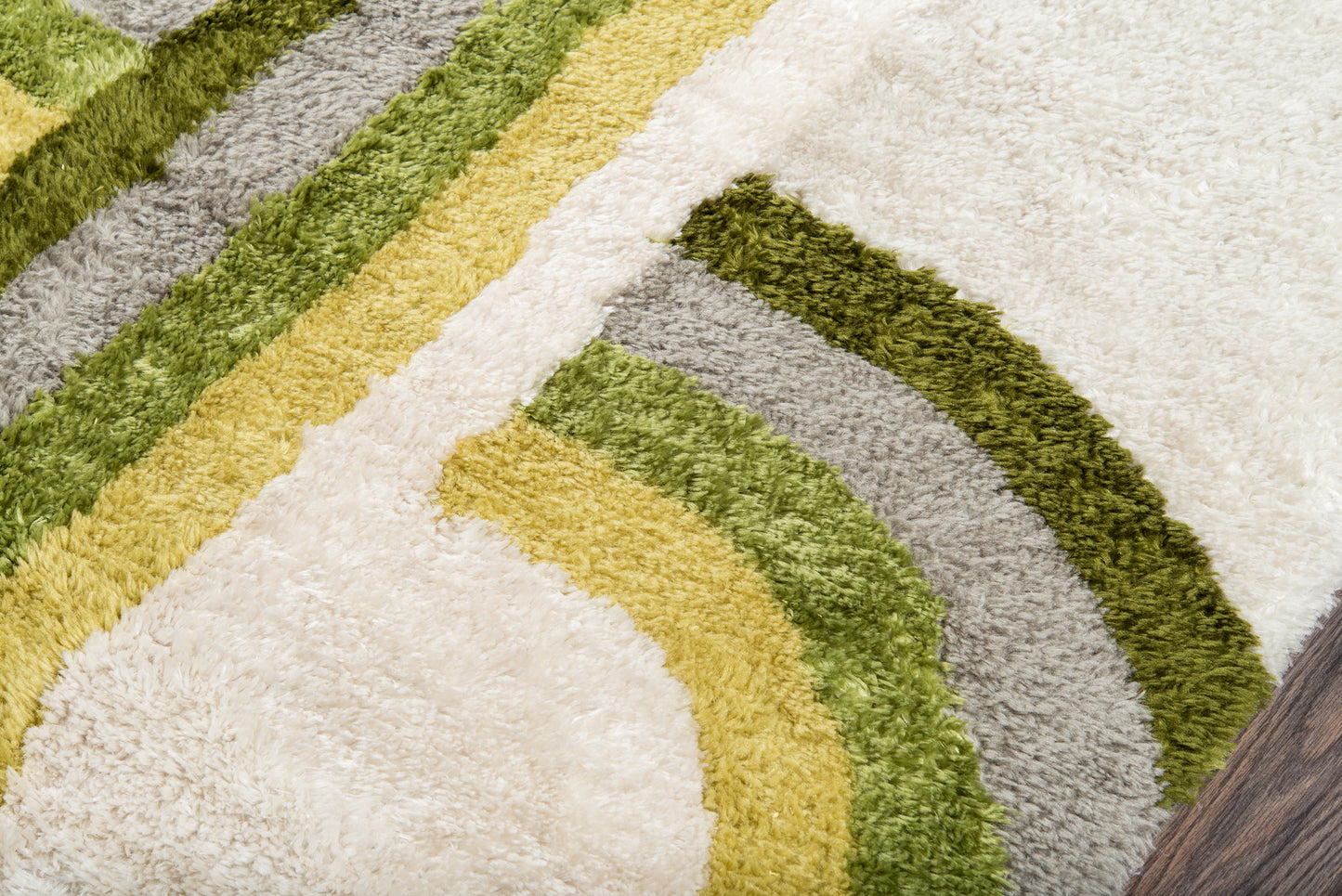 Shaggy retro runner with curved stripes in mustard, olive green & sage gray on cream field; plush, rectangular.
