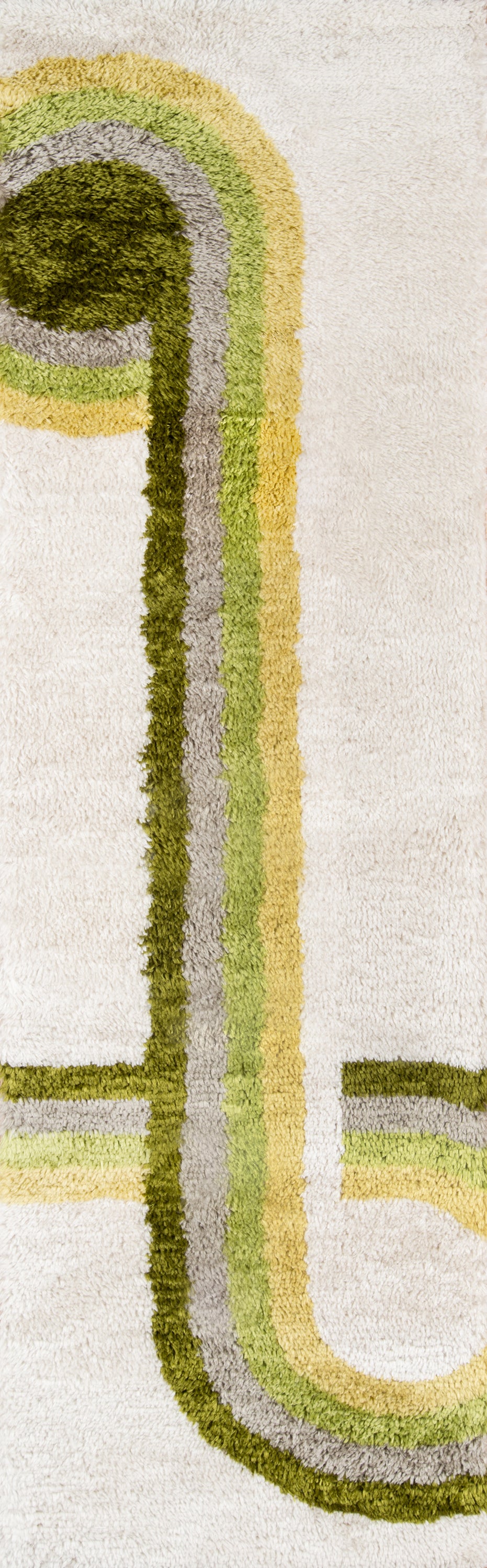 Retro green rug with layered olive, lime, sage, gray & brown stripes forming a curved loop on beige background.