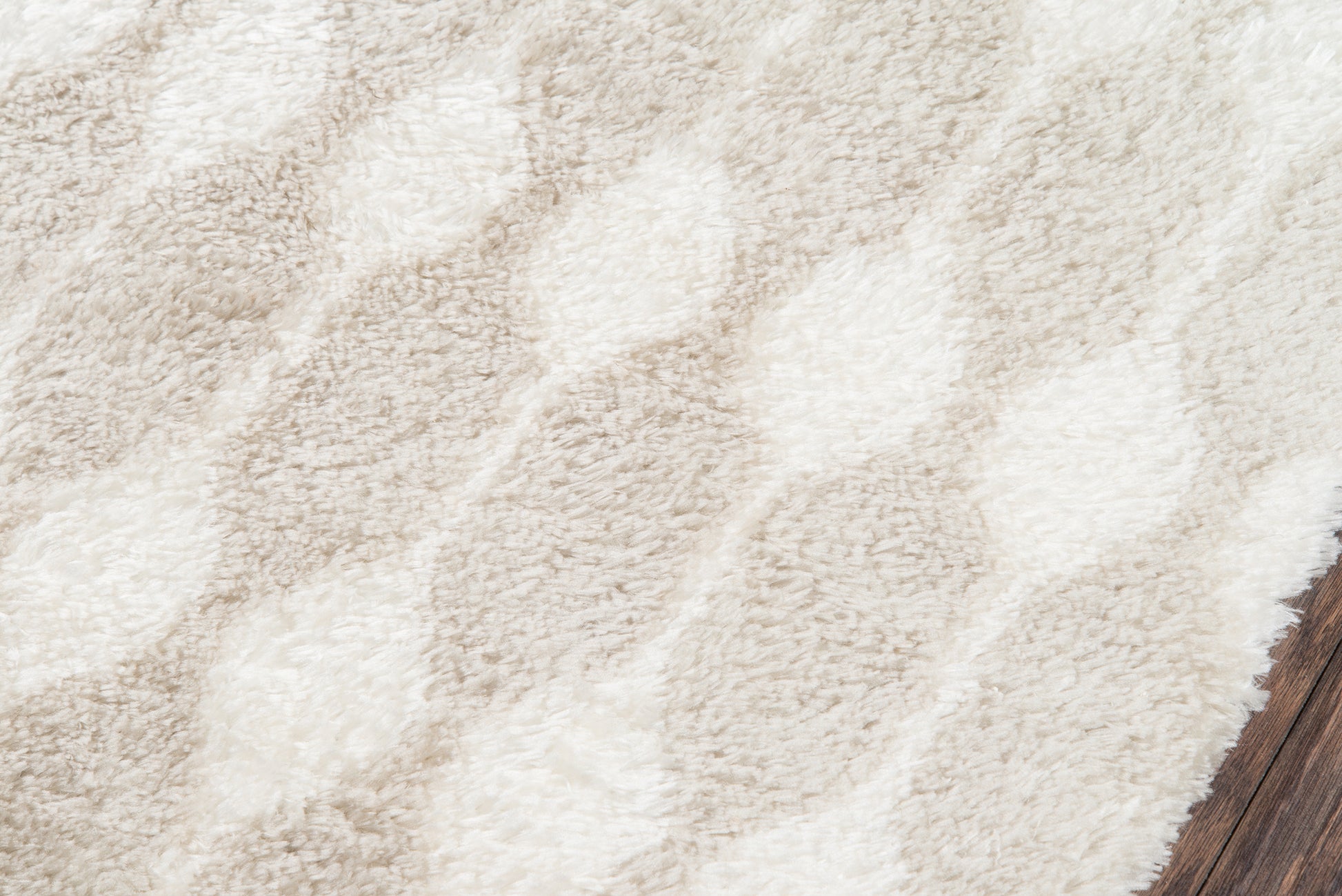Taupe and ivory shag rug with diagonal pattern and plush texture, ideal for living room decor on wood floor.