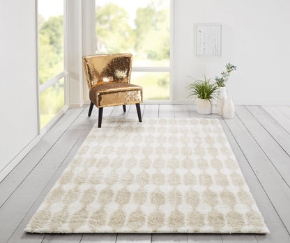 Taupe and cream retro-pattern shag rug in a bright room with a gold sequin chair and potted plants.