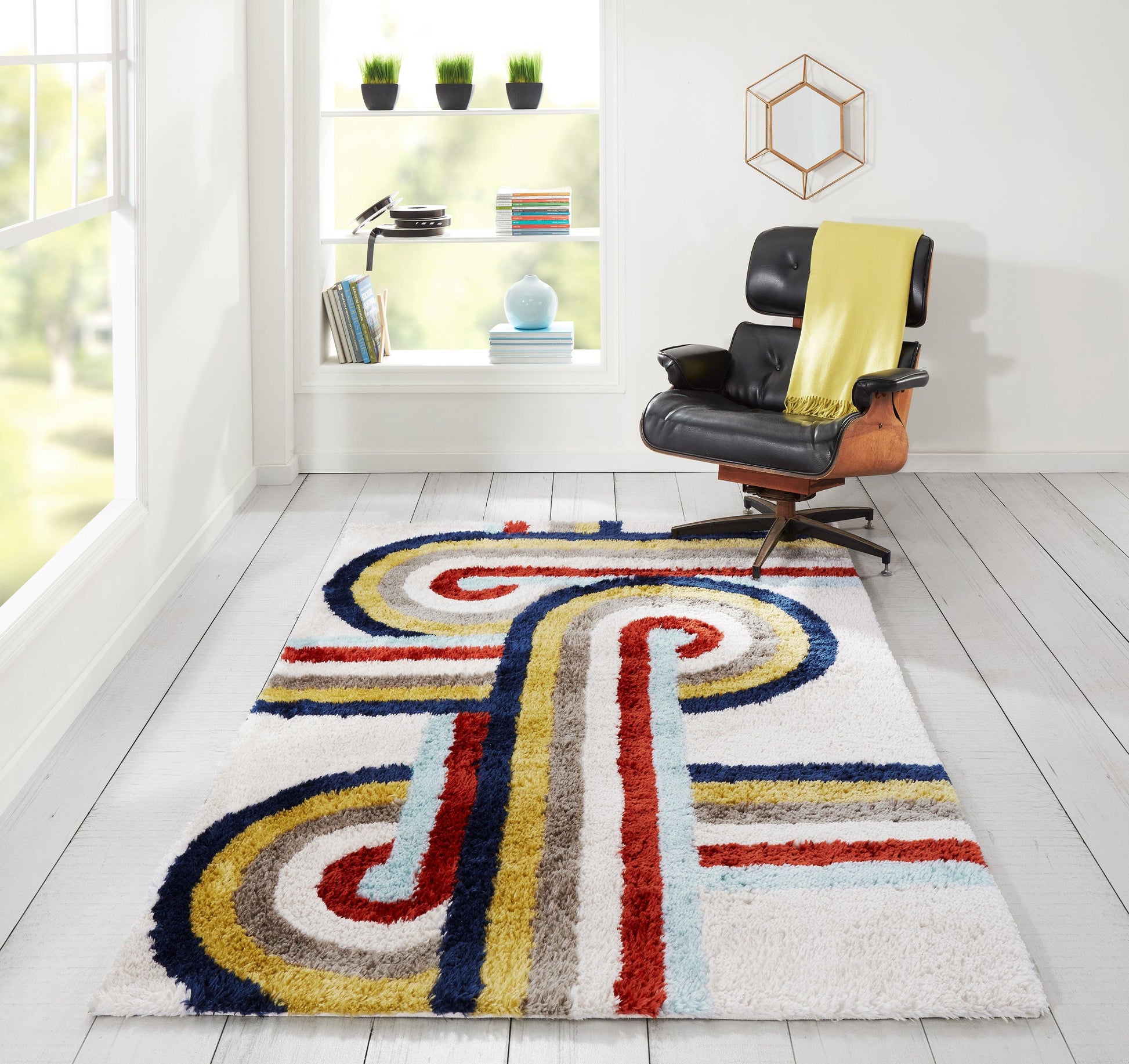 Shaggy retro rug with bold multicolor swirls and stripes in red, blue, yellow and gray; modern living room.