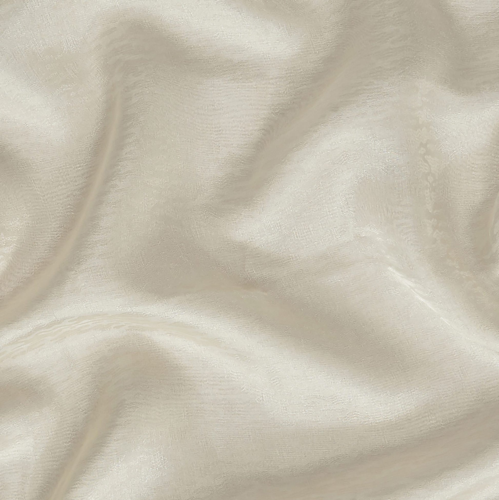 Ivory ripple jacquard sheer fabric with soft drape; wide width, for apparel and home decor.