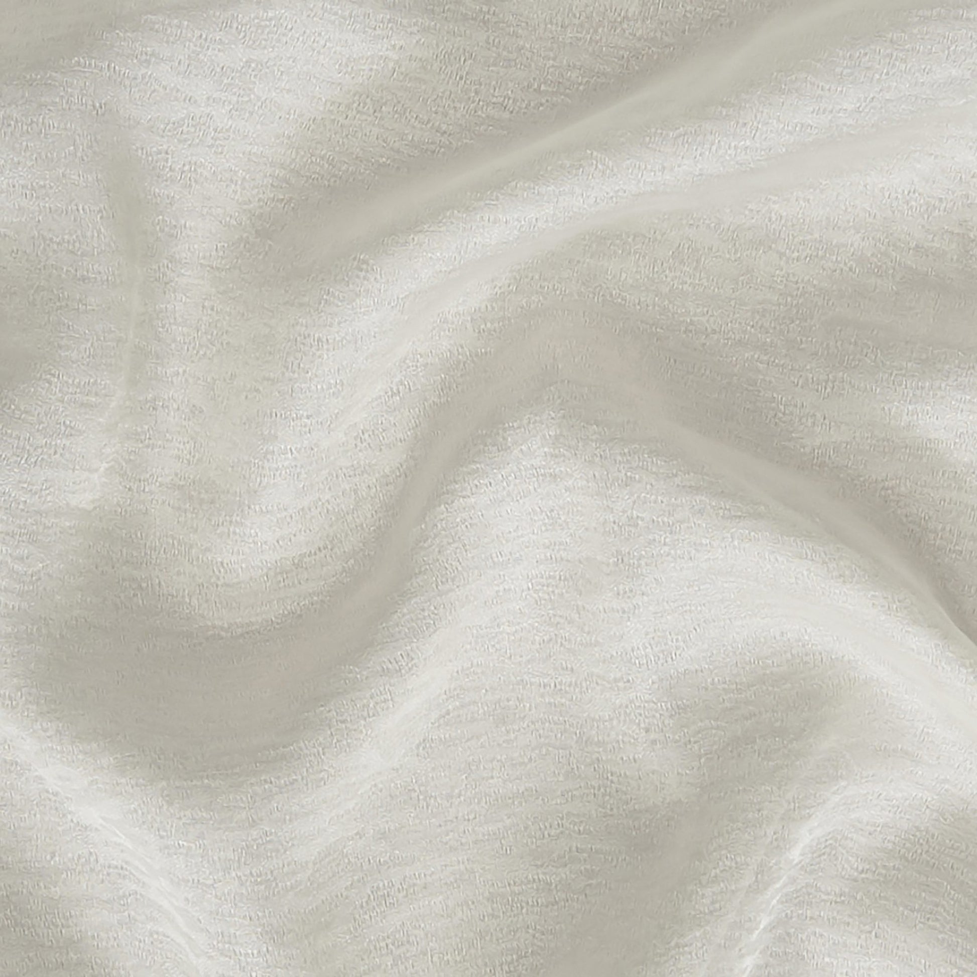 Creme/beige ripple-textured fabric with soft folds; lightweight, sheer jacquard fabric suitable for apparel or home decor; wide width.
