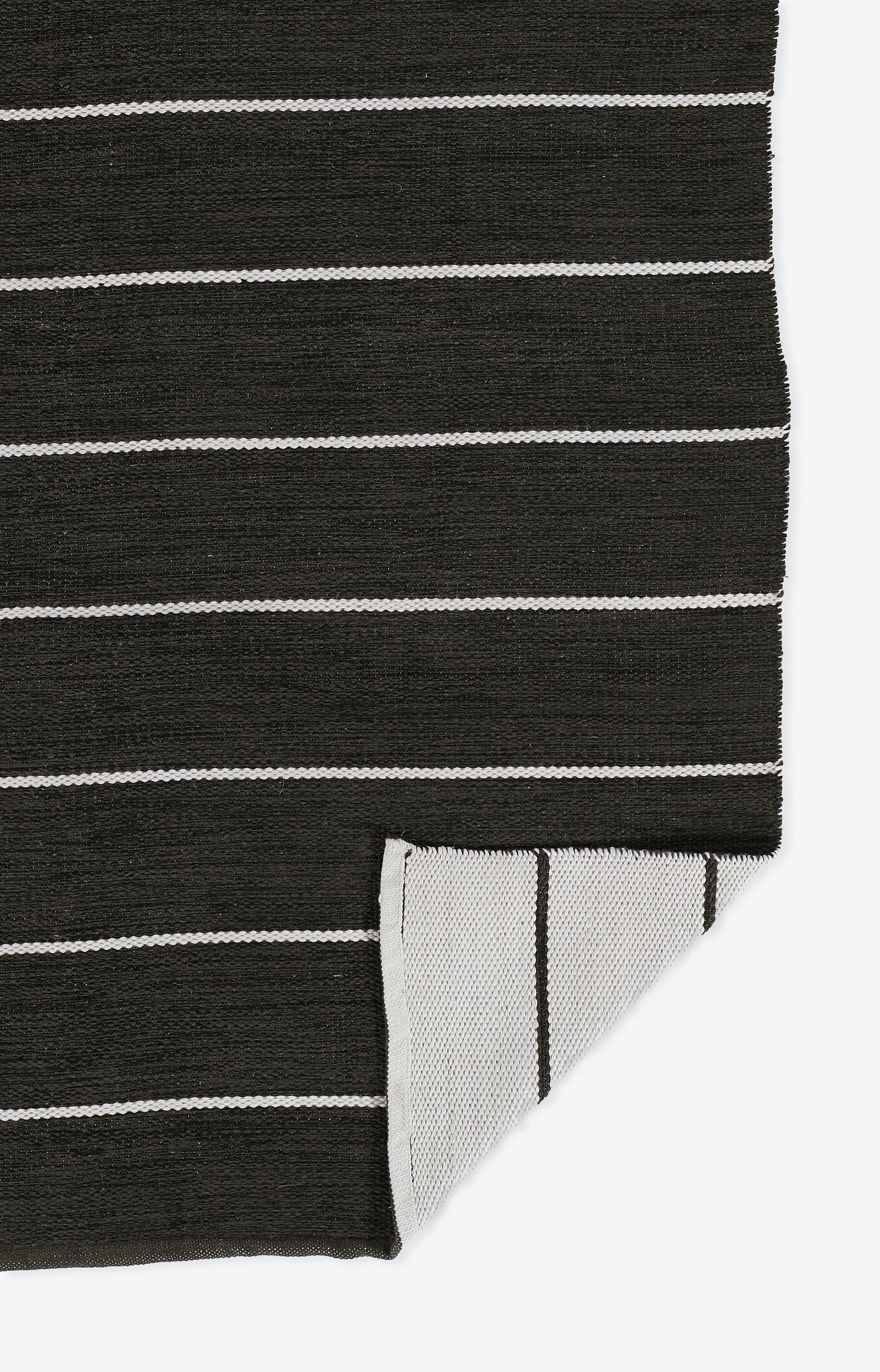 Black knit fabric with white horizontal stripes; folded corner shows light gray underside with thin black vertical lines.