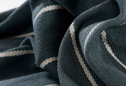 Dark teal textured knit blanket with cream stripes, rectangular woven throw for couch or bed