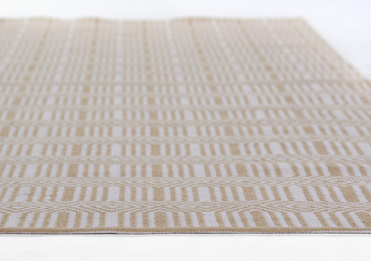Beige and cream flat-weave rug with repeating geometric chevron stripes; rectangular natural-style home decor.