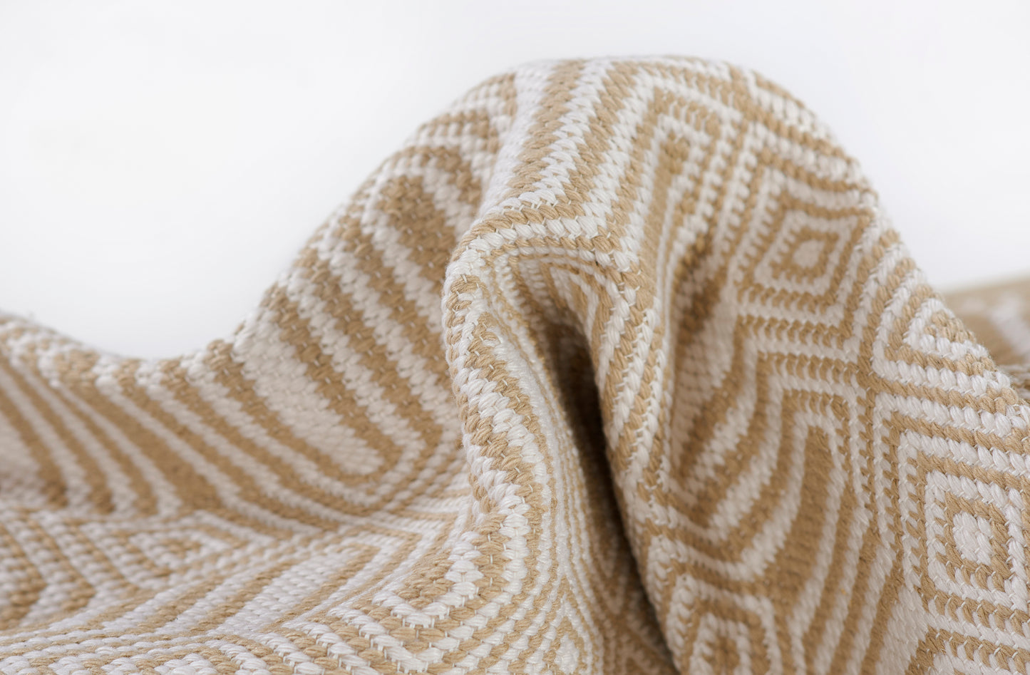 Beige and cream geometric woven rug with diamond pattern, 4' x 6'.