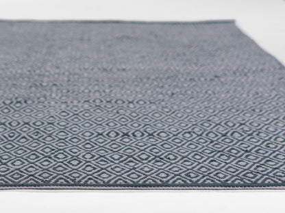 Blue-gray flat-weave rug with a white diamond lattice pattern; rectangular hallway piece.