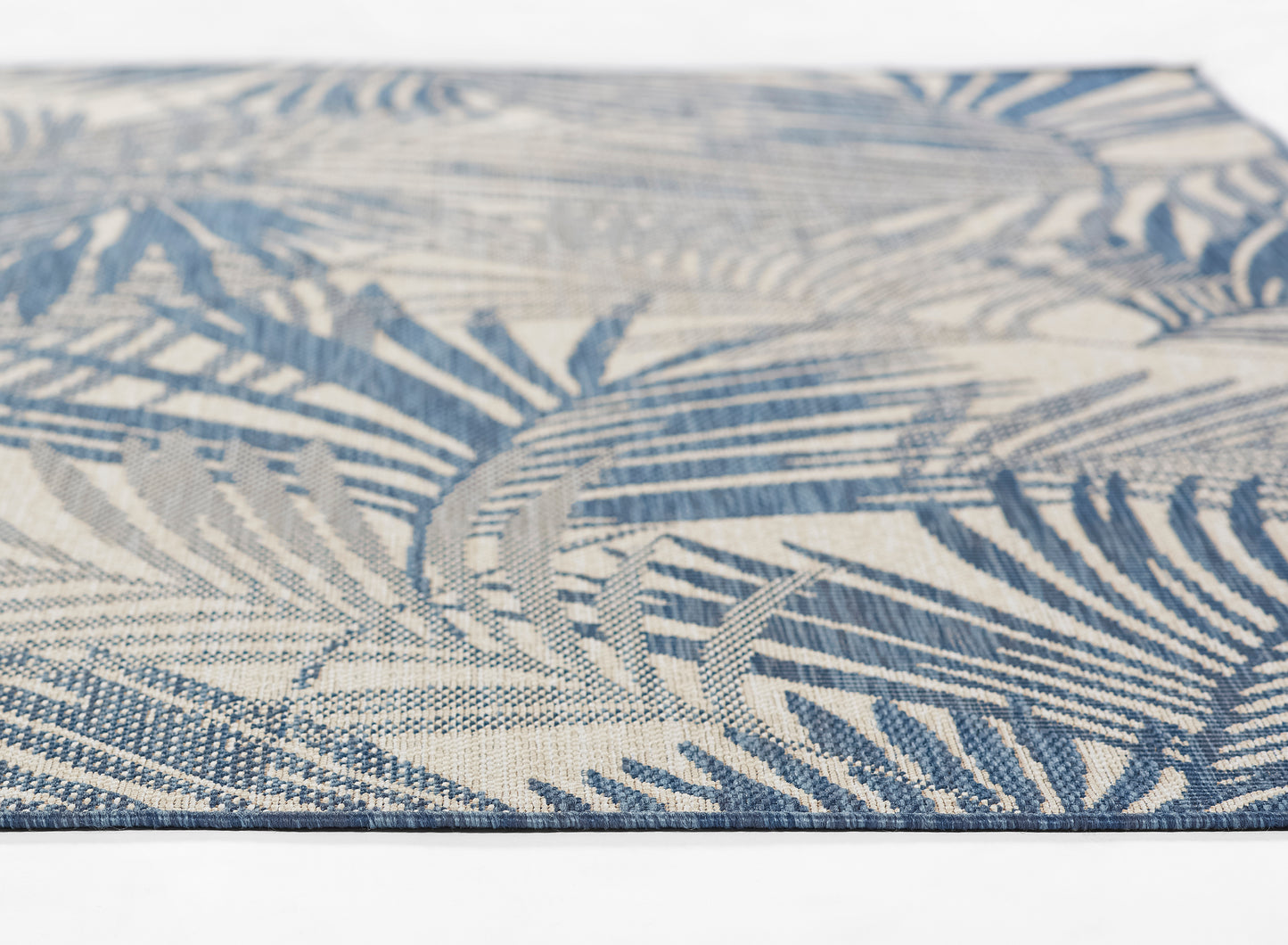 Blue & beige palm-leaf patterned woven rug, rectangular, textured, tropical home decor accent