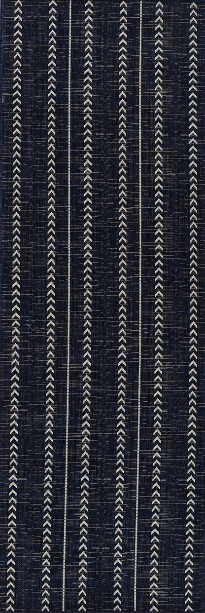 Navy fabric with repeating vertical white chevron stripes in a geometric woven pattern.