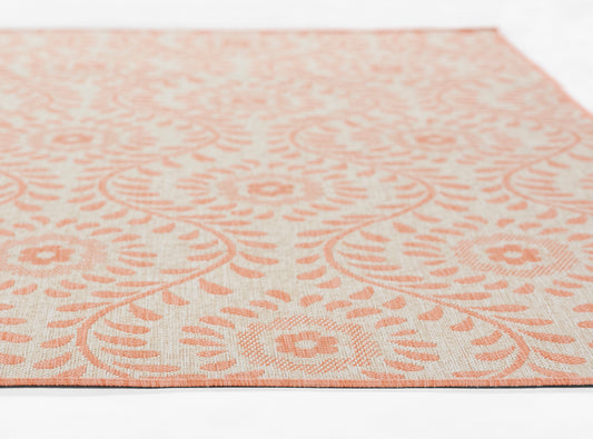 Rectangular 3' x 8' runner rug with peach floral damask pattern on cream background; woven textile for living room decor.
