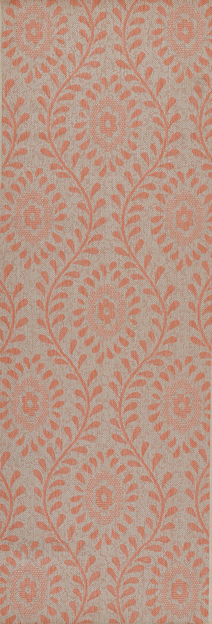 Coral-pink damask pattern with circular floral medallions and curling vines on a beige background.