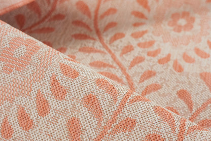 Peach & cream jacquard rug with botanical leaf damask pattern and textured weave.