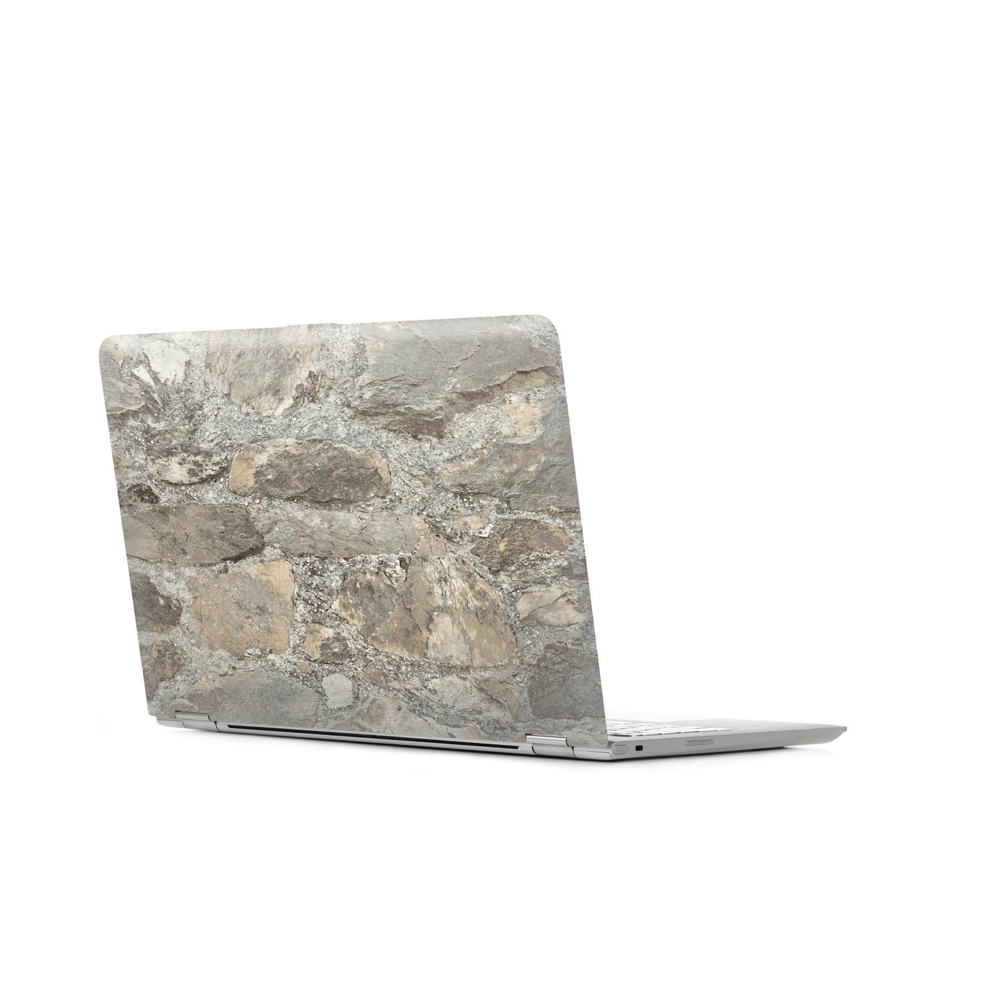 Close-up of weathered stone almond peel-and-stick wallpaper with a gray stone texture.