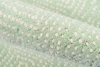 Mint green rug runner with white dotted texture; plush, soft fabric.