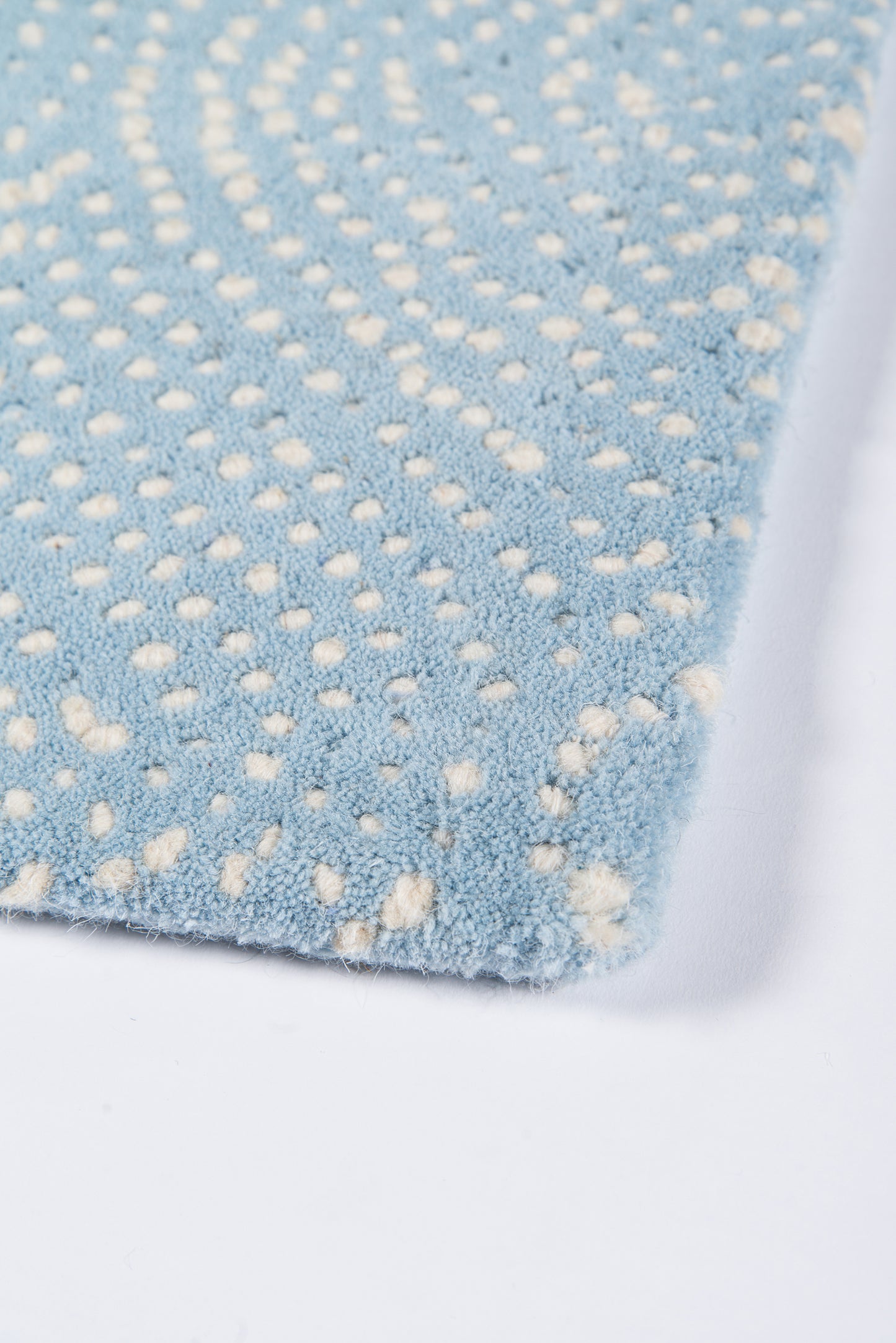 Light blue plush runner rug with a white dotted pattern, soft microfiber texture, 2' x 8' rectangular hallway rug.