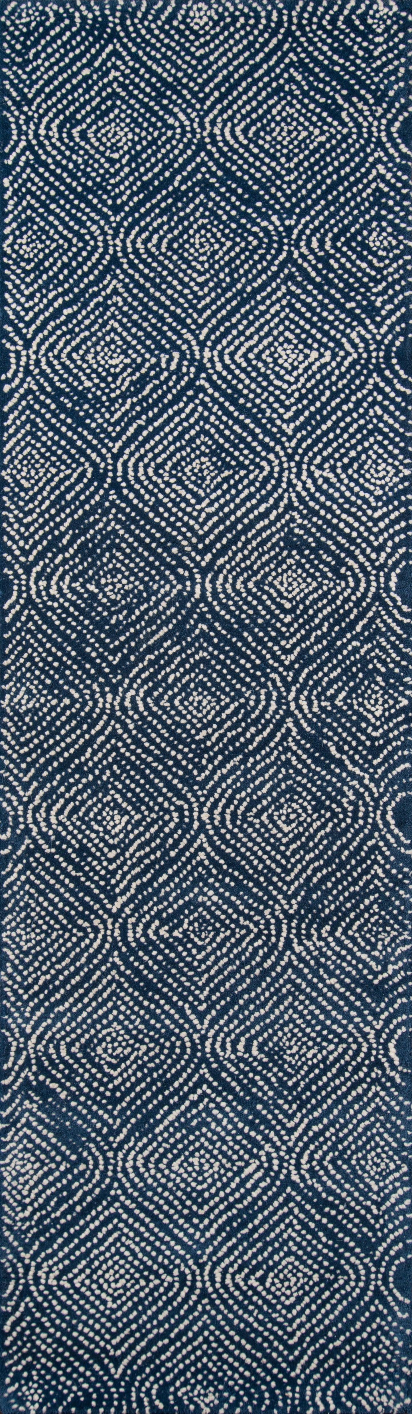 Denim-inspired blue woven fabric with white circular geometric ikat pattern; versatile for clothing & upholstery.