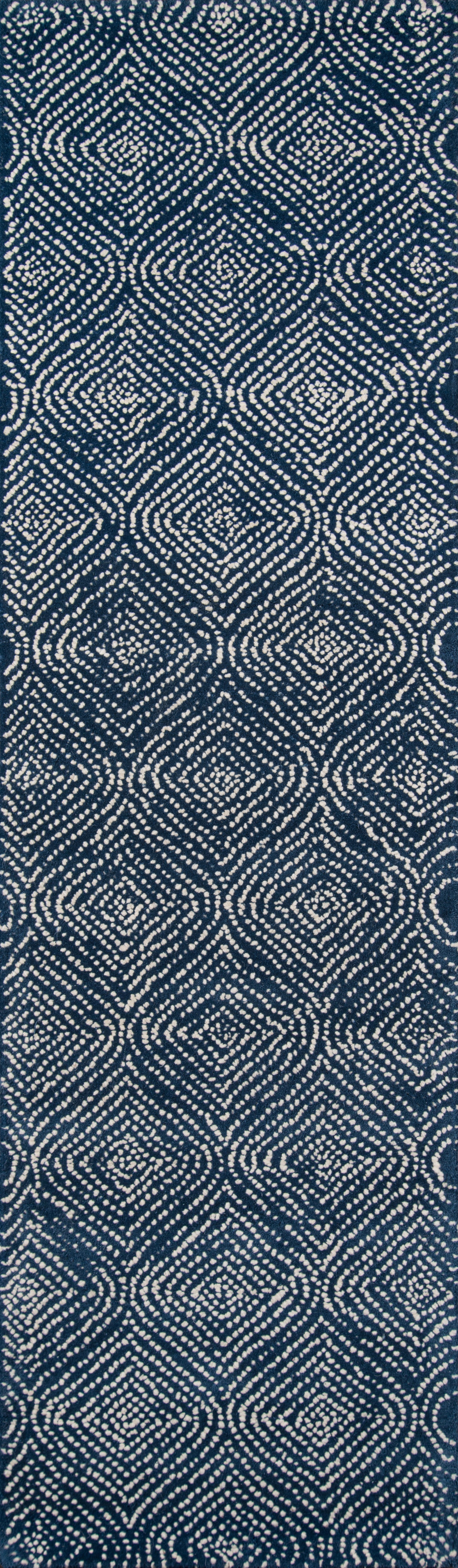 Denim-inspired blue woven fabric with white circular geometric ikat pattern; versatile for clothing & upholstery.