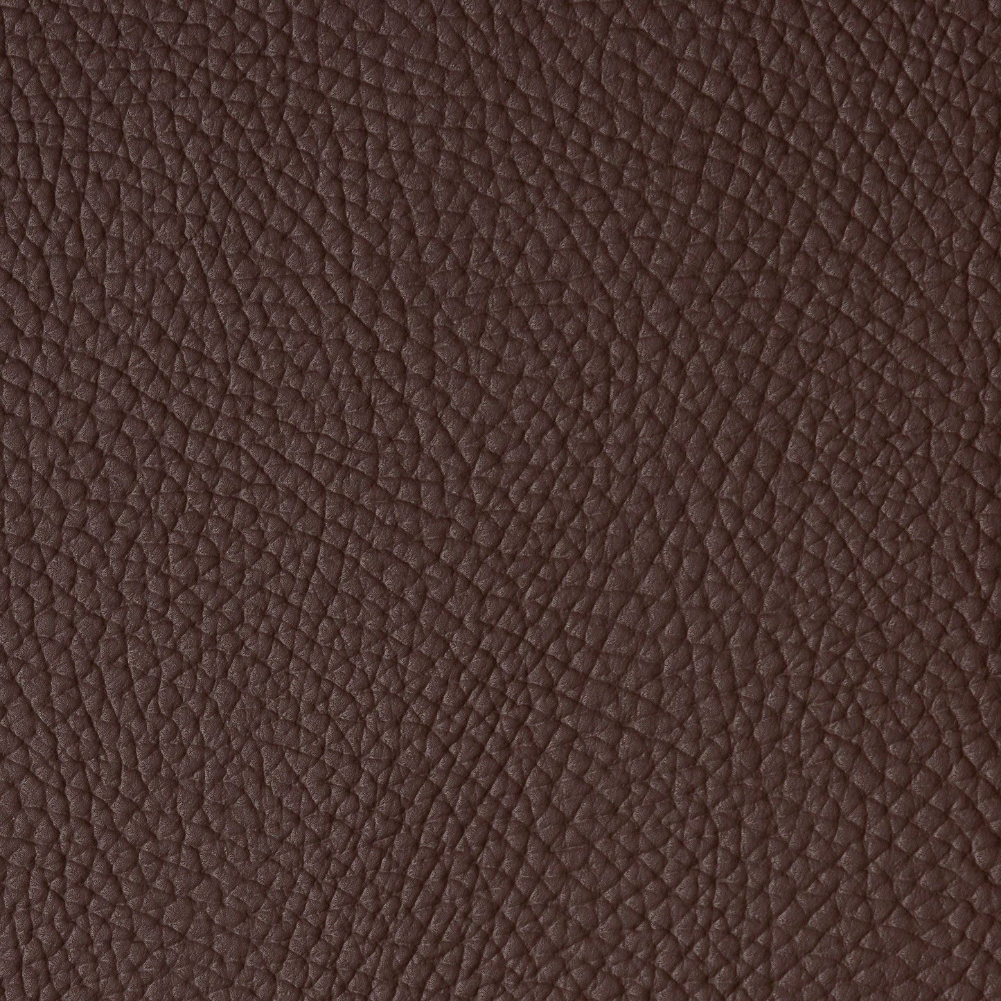 Close-up of dark brown vegan leather with pebbled grain.