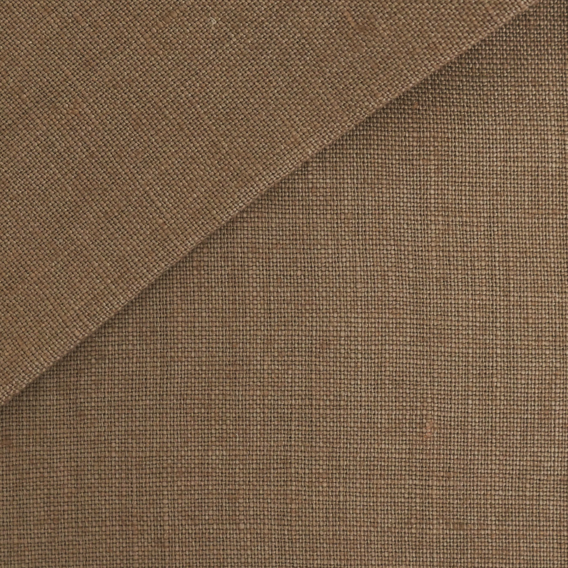 Brown woven linen fabric swatch with diagonal fold, close-up texture.