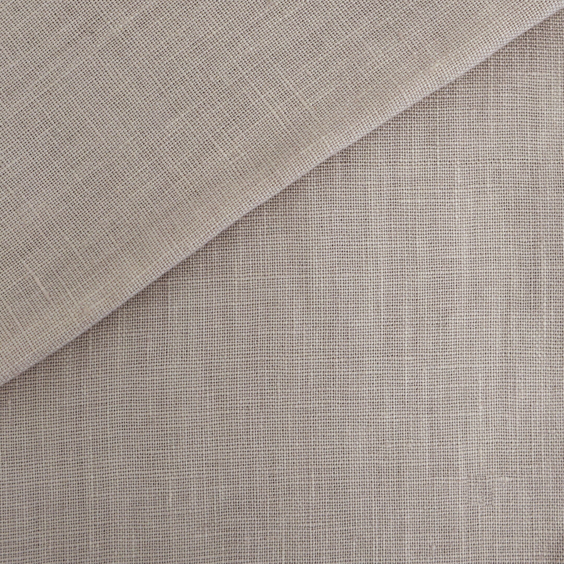 Purple linen-look fabric swatch with folded corner and soft texture.