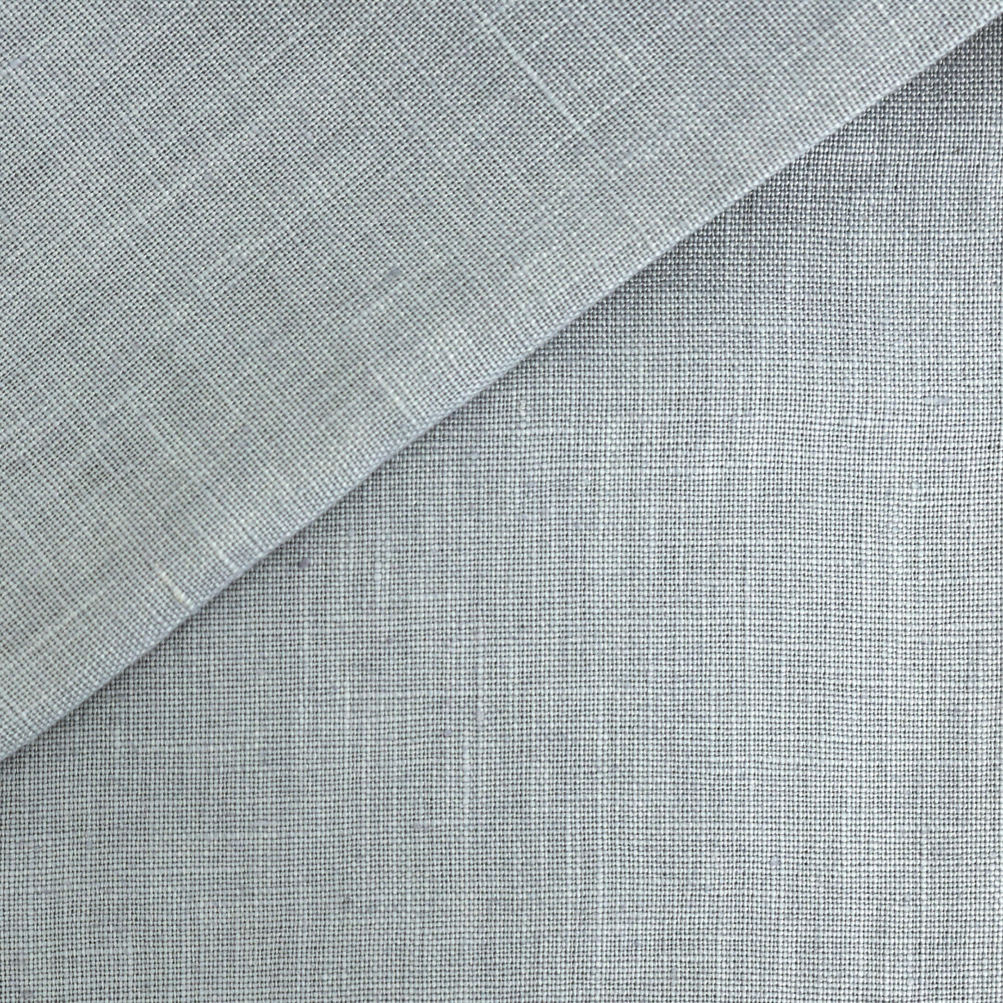 Blue linen fabric swatch with folded corner; textured weave for drapery, upholstery, or crafts.