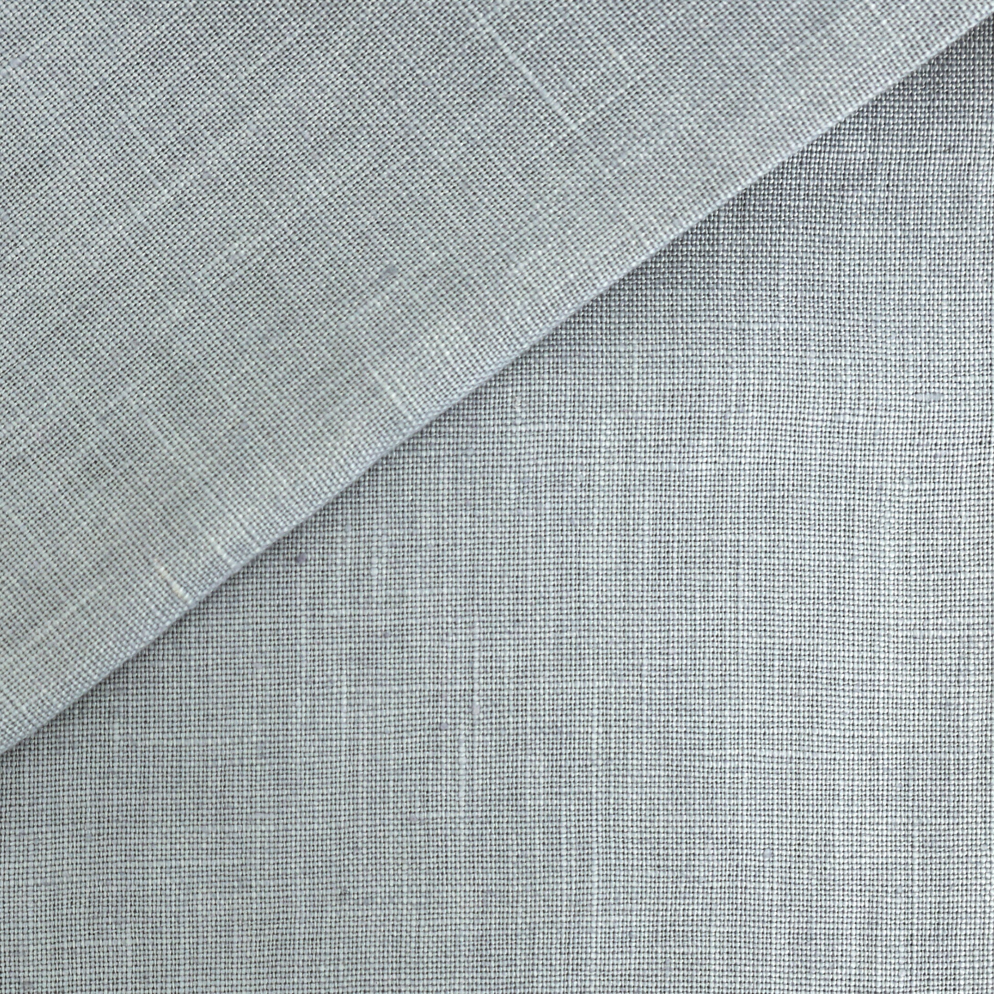 Blue linen fabric swatch with folded corner; textured weave for drapery, upholstery, or crafts.
