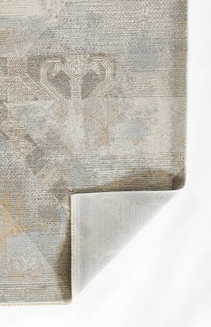 Beige-blue jacquard rug with a subtle damask motif and woven texture, folded corner.