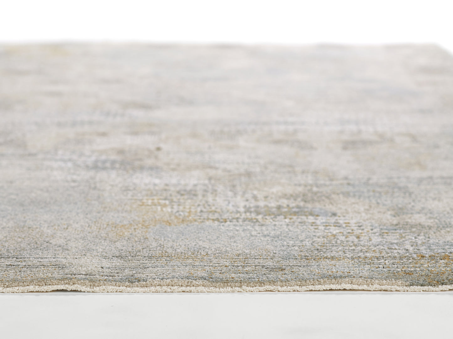 Blue-gray textured flatweave rug with subtle beige undertones, rectangular, cozy living room floor decor.