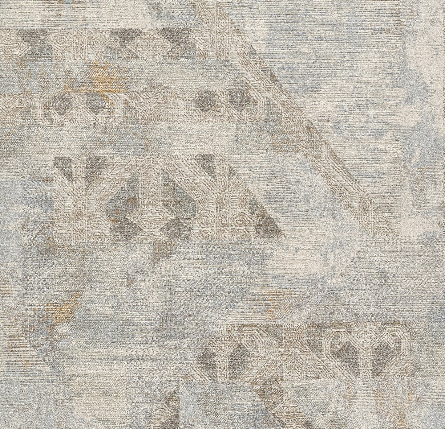Distressed abstract rug in blue-gray and beige with muted geometric motifs and vintage-inspired patterns.
