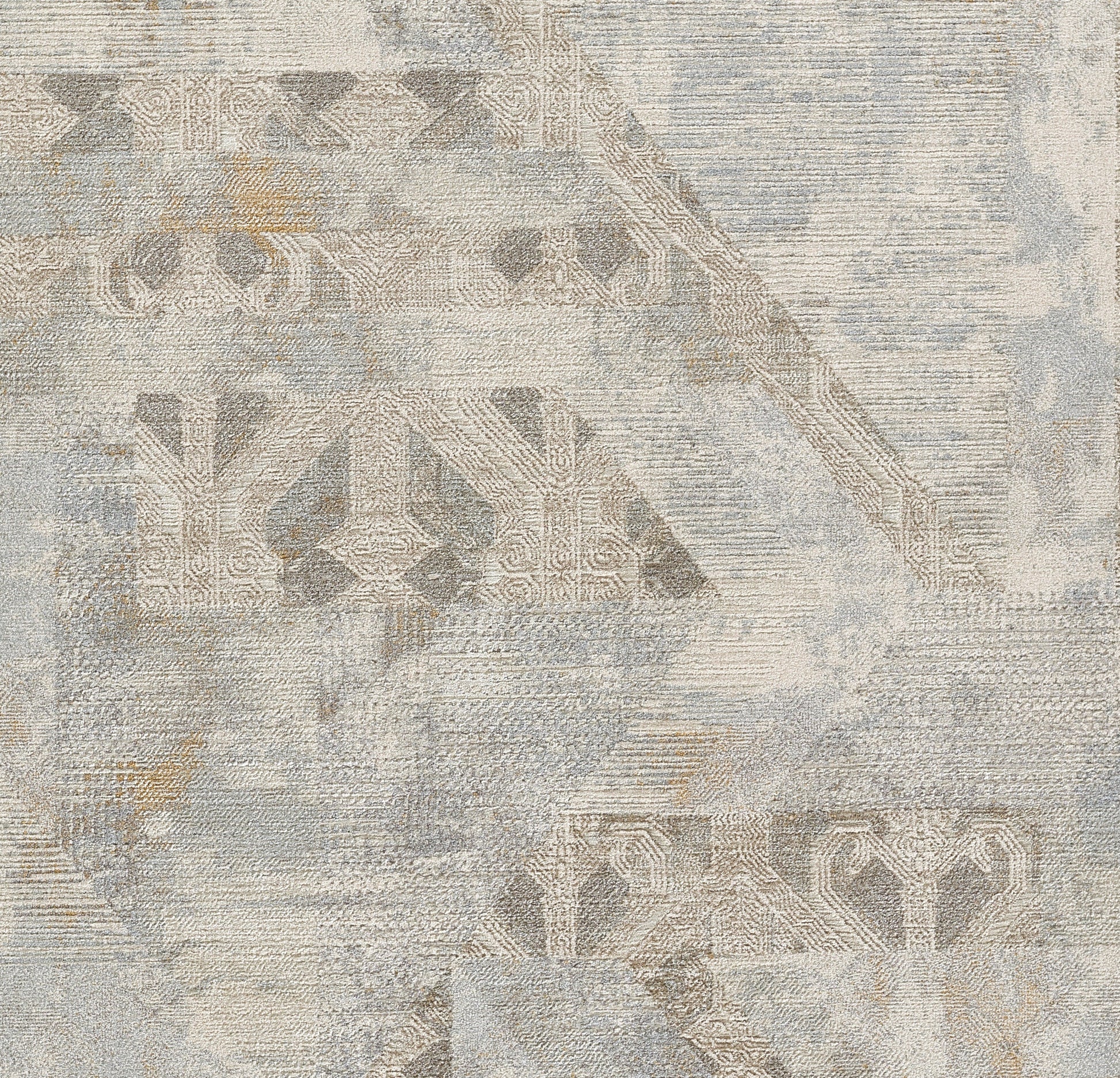 Distressed abstract rug in blue-gray and beige with muted geometric motifs and vintage-inspired patterns.