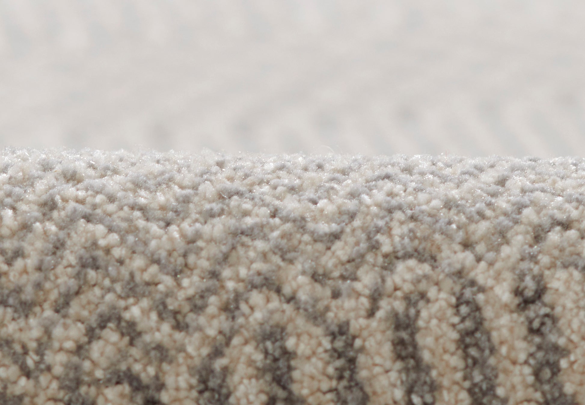 Beige textured loop-pile runner rug with subtle taupe geometric pattern; cozy living room flooring.