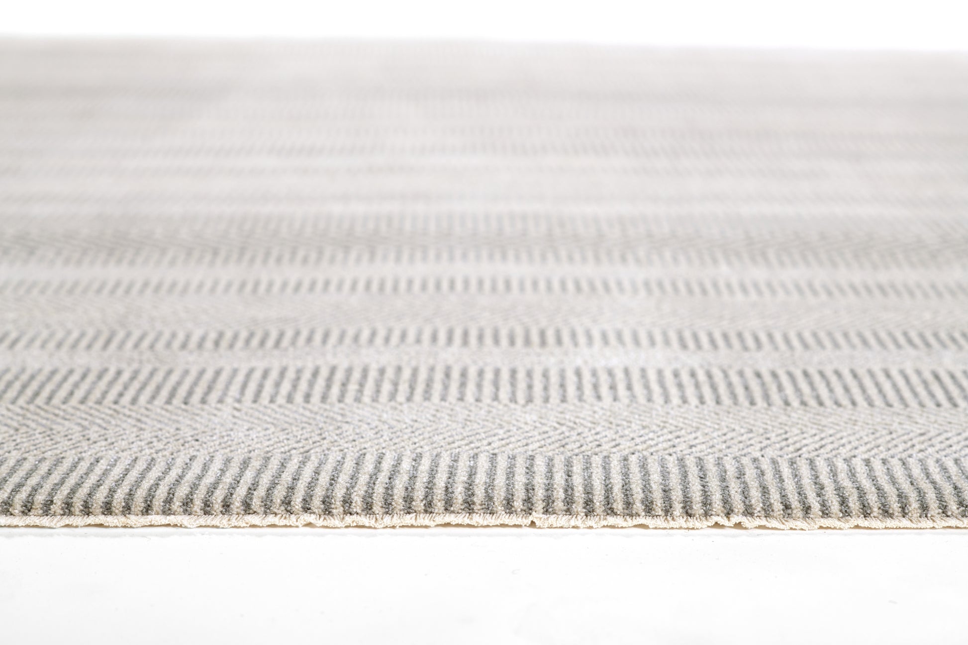 Gray and ivory flat-weave runner rug with subtle diagonal stripes and a textured weave.