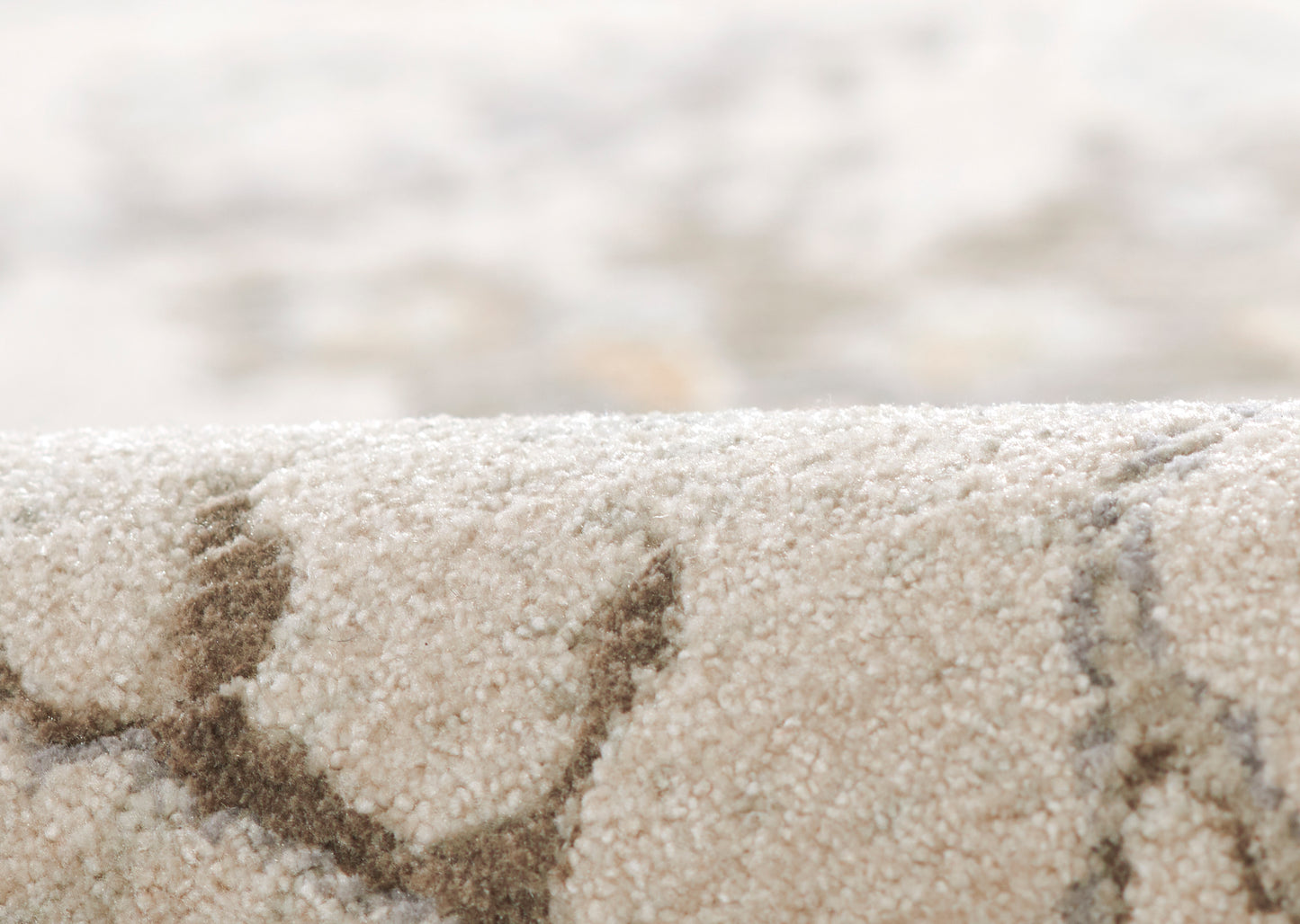 Beige shag rug with dark brown curved lines; plush loop-pile texture for modern home décor.