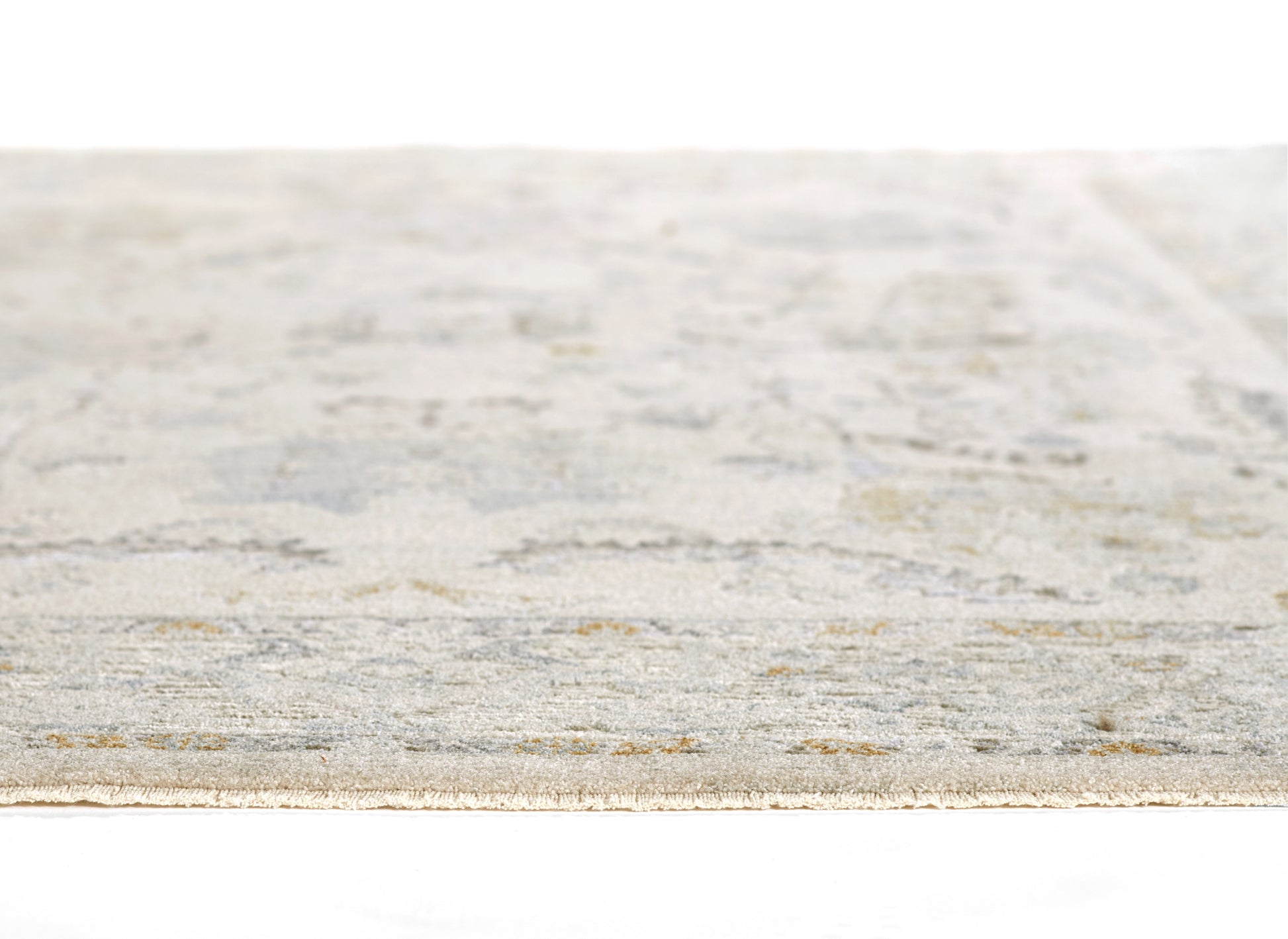 Rectangular flat-weave rug in pale blue, gray and beige with a subtle distressed pattern; versatile area rug.