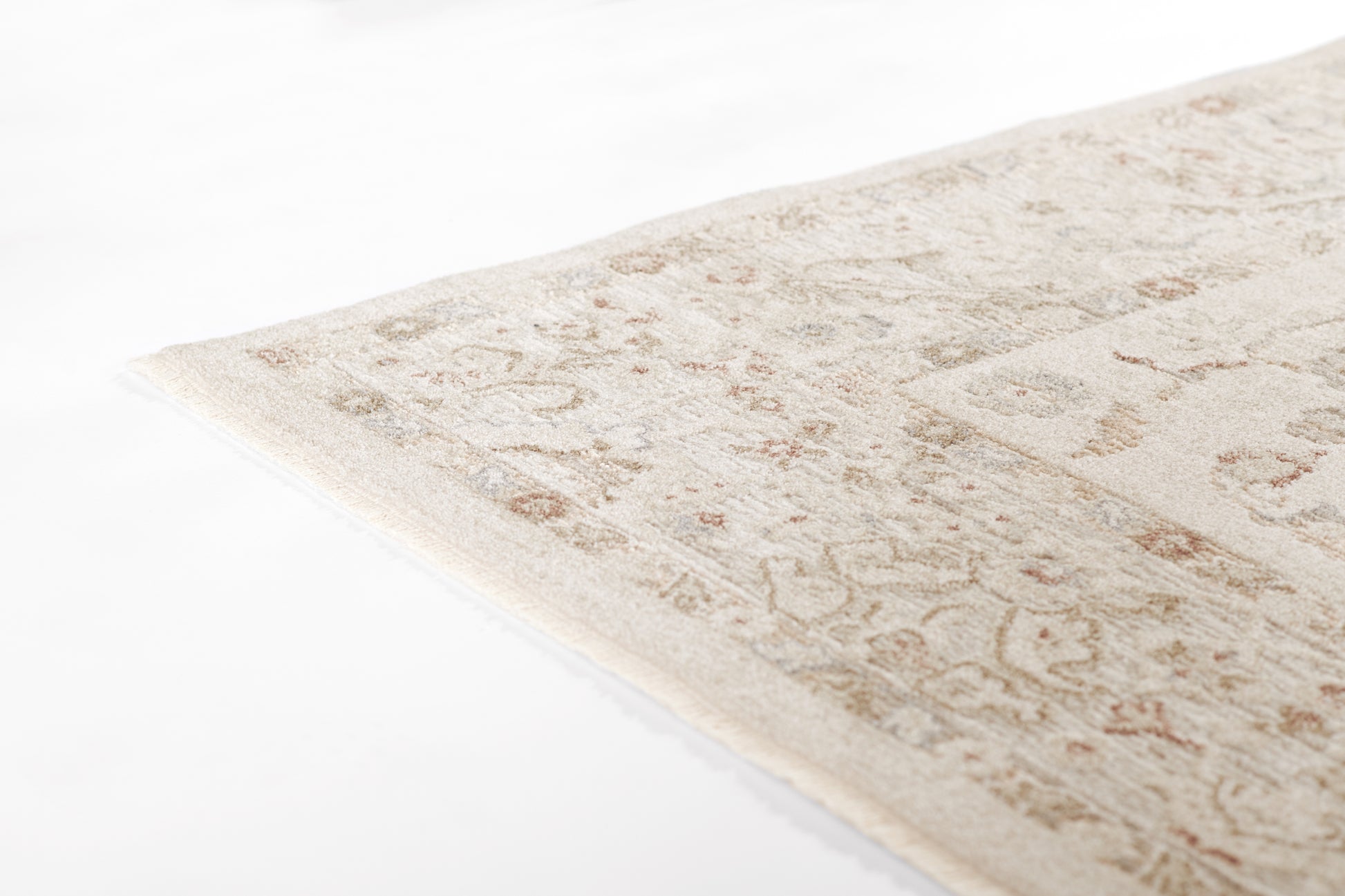 Cream-beige traditional area rug with subtle floral motif, soft woven texture, rectangular for living rooms