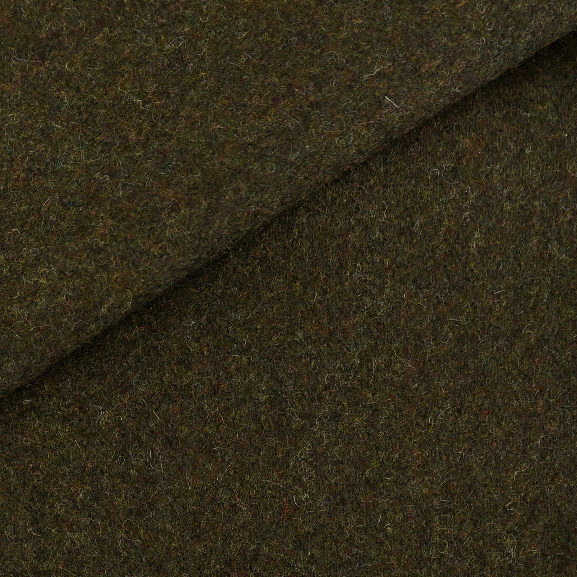 Plain brown wool fabric close-up with a diagonal seam; textured, soft felted weave for coats or outerwear.