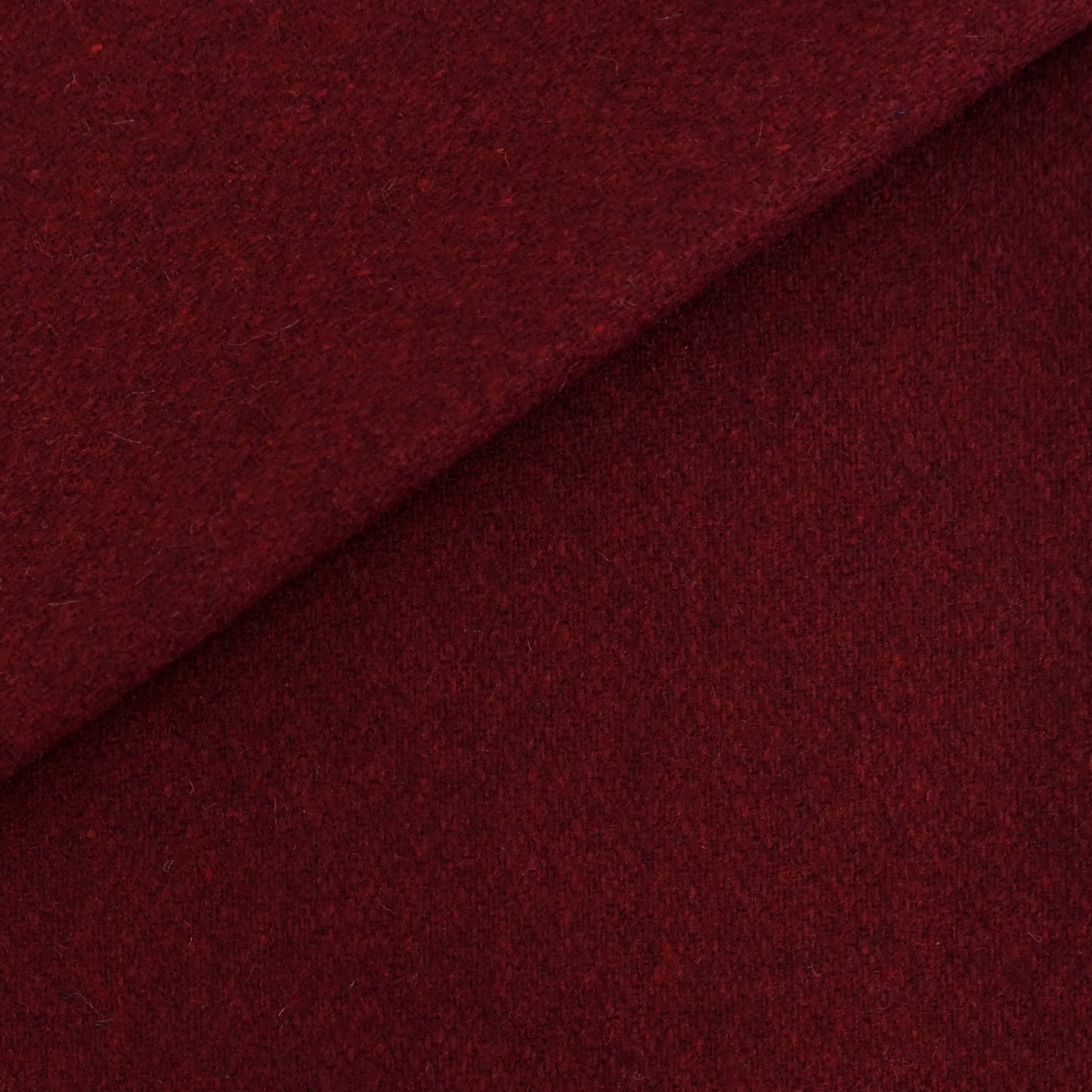 Deep burgundy fabric with a diagonal fold; soft, wool-like texture and rich red color.
