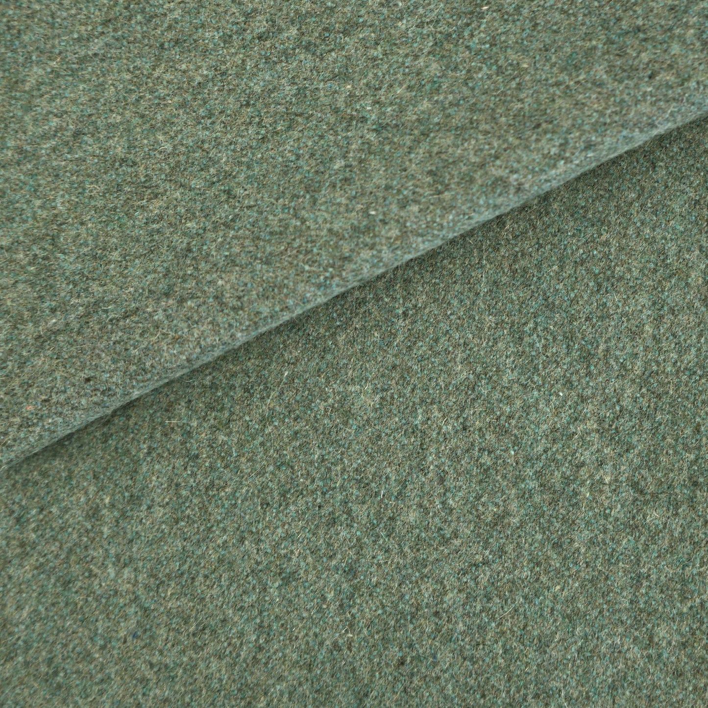 Plain blue wool fabric swatch with a textured weave.