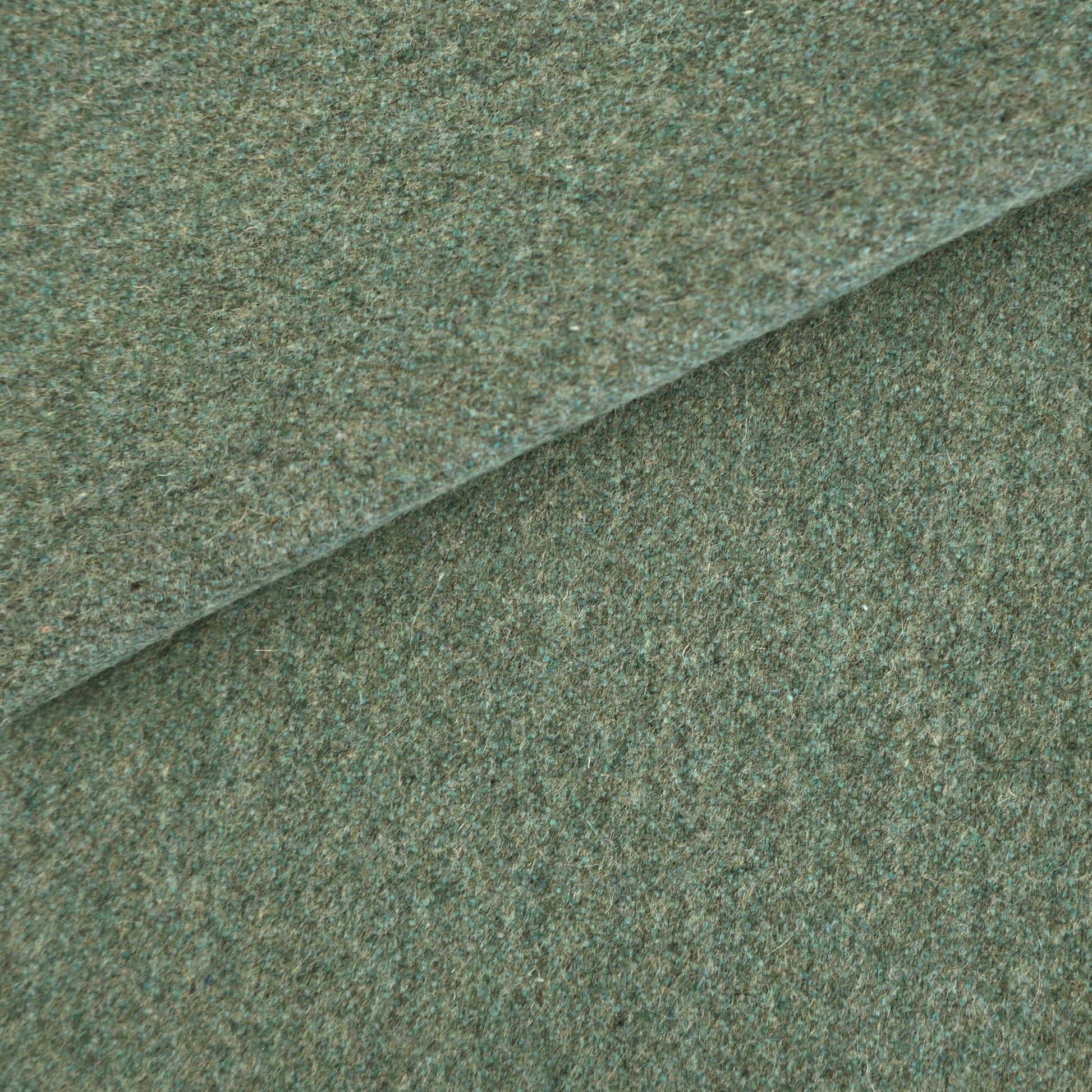 Plain blue wool fabric swatch with a textured weave.